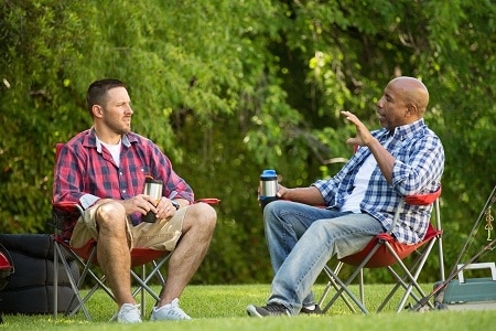 Men talking and camping