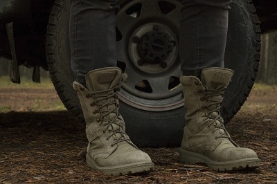 military boots in front of wheel