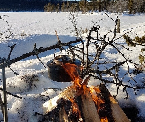 snow melted in pot under fire