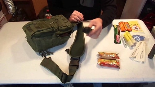 man packing supplies in a go-bag