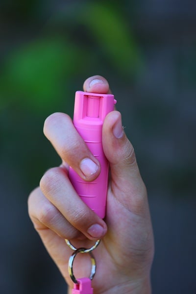 pink pepper spray on hand