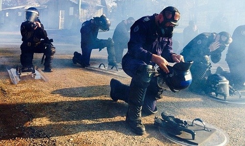 Police wearing gas mask