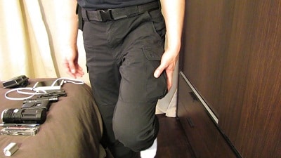hand holding pocket of cargo pants