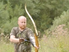 Young archer training with longbow