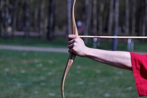 hand gripping recurve bow