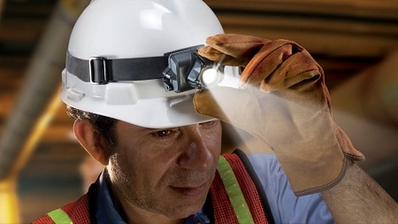 man wearing a hard hat with headlamp on
