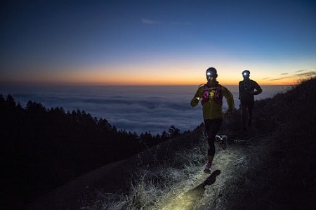 trail runners by the mountain at the break of dawn