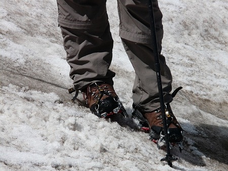 hiker's legs shown on a snowy slope