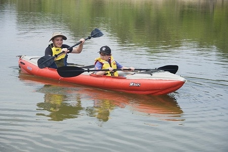 kids paddling inflatable kayak