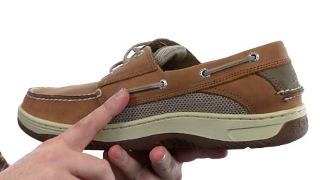 man holding a boat shoe