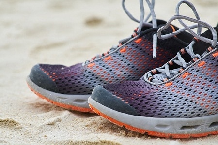 mesh shoes on sand upclose