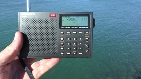 Portable radio held out to an open space