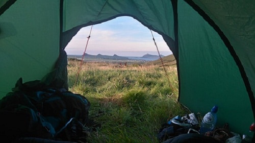 View of tent door from the inside overlooking landscape