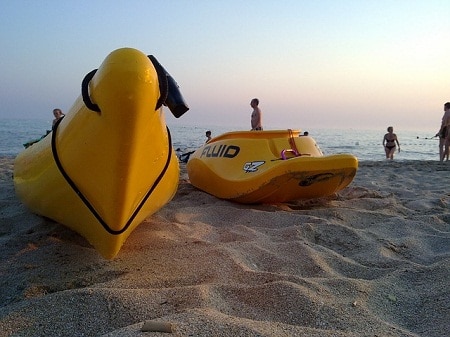 yellow kayaks on the shore