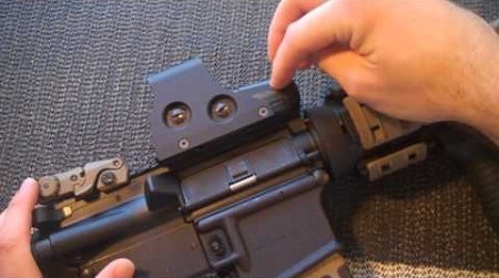 finger pointing at EOTech 551 on rifle