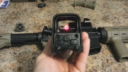 holographic sight held over air rifle