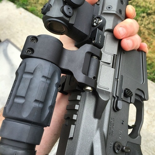 red dot sight magnfier mounted on rifle upclose