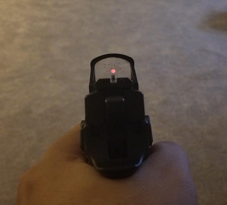 red dot sight view on pistol