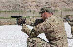 military practice shooting pistol on range