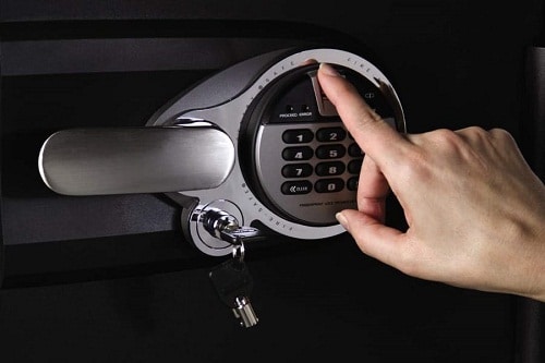 gun safe locks upclose, hand unlocking using biometrics