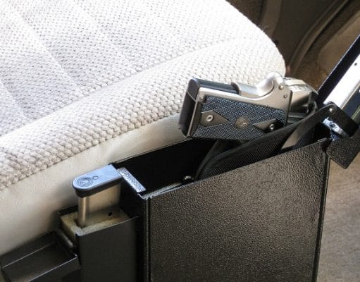 gun safe with pistol by car driver seat