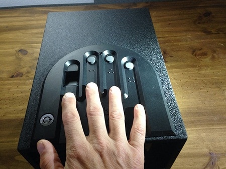 hand opening a GunVault Minivault GVB1000 with biometrics