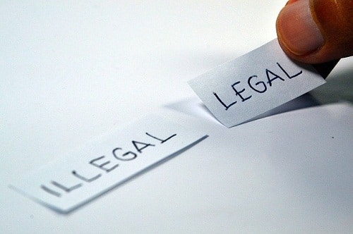 illegal legal written on paper strips