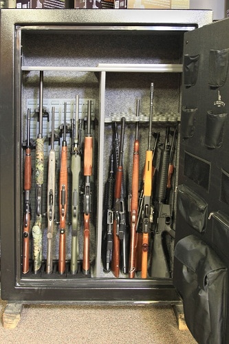 open gun safe full of rifles