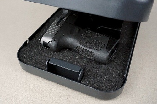 pistol handle showing from gun case
