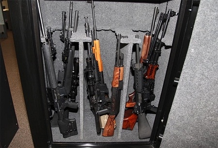 rifles inside an open gun safe