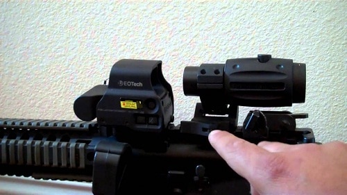 sight and magnifier on rifle