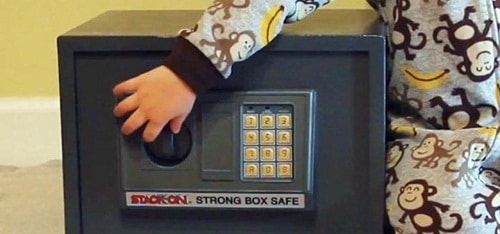 toddler playing with the gun safe lock