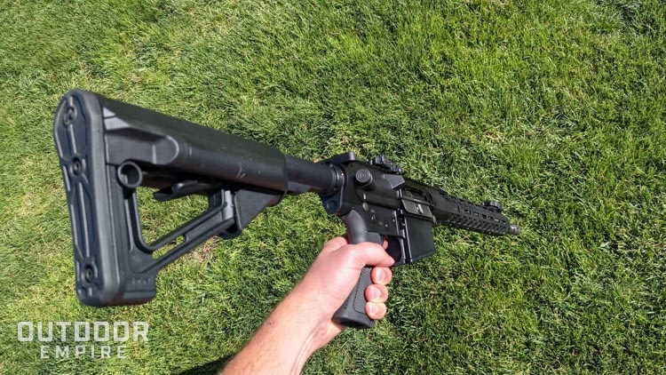 PSA AR-10 in left hand looking down from above pointed at ground