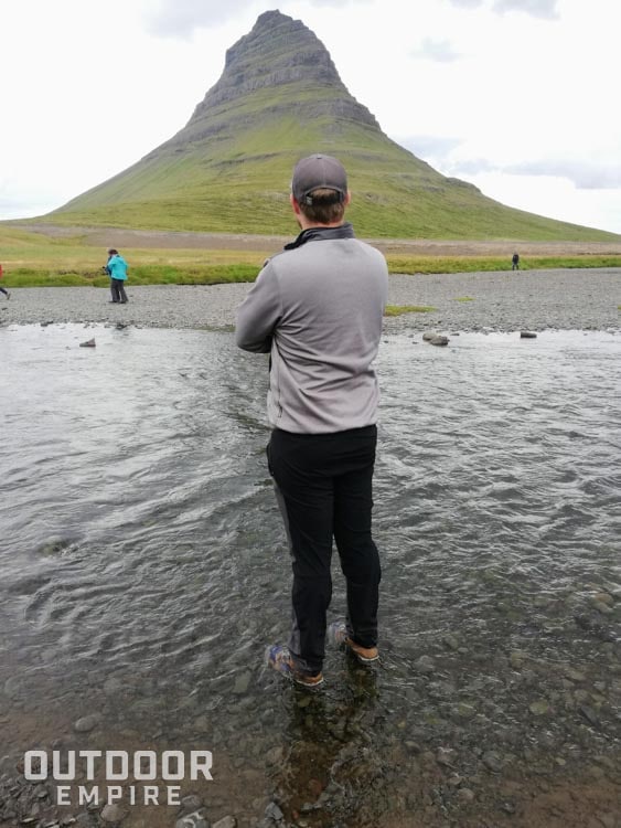 Standing in creek up to ankles in Kodiak Skogan boots in front of Mount Kirkjufell in Iceland