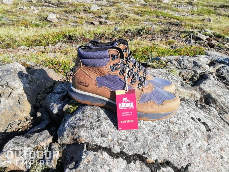 New Kodiak Skogan boots with waterproof tag sitting on rock