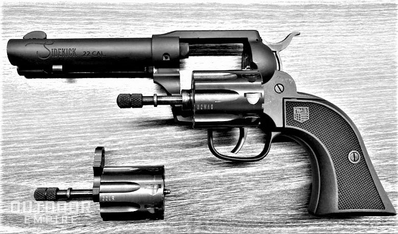 Diamondback The Sidekick .22 caliber revolver with extra cylinder on table next to it