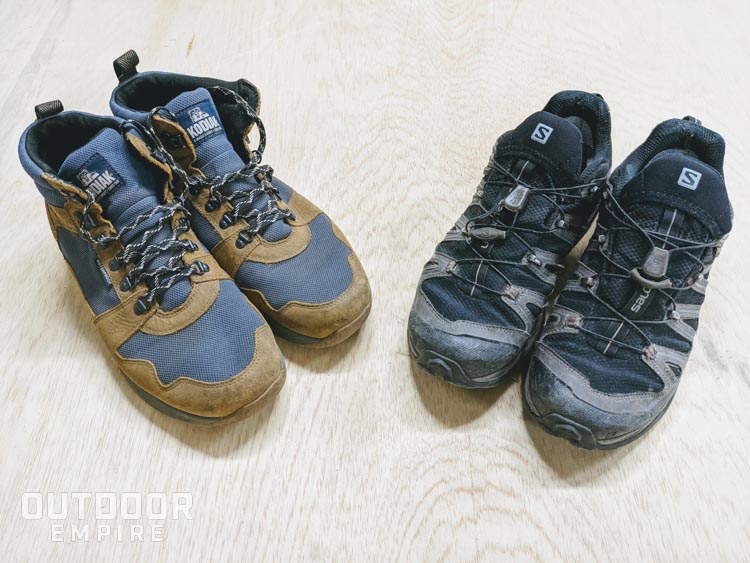 Hiking boots next to trail running shoes