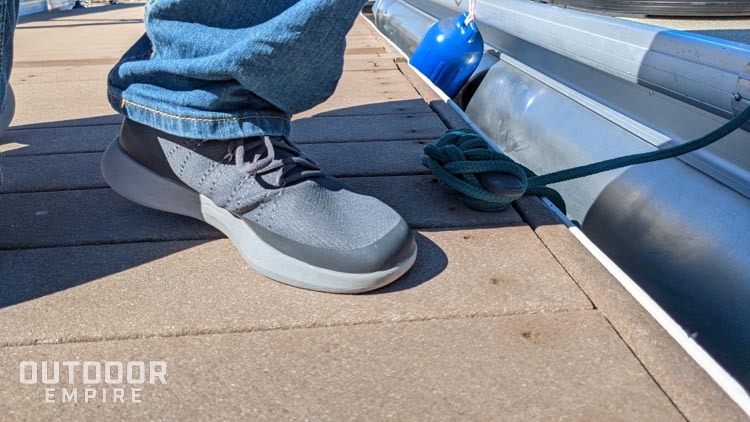 Pucker in grundens sea knit boat shoe on a boat dock