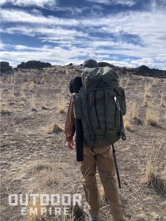 back view of a hiker with a Kelty Coyote backpack