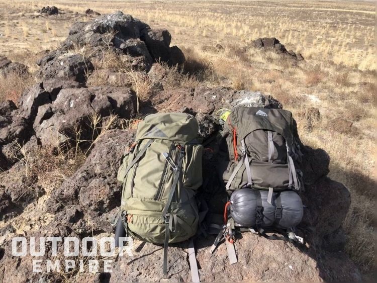 Kelty Coyote vs Kelty Tioga backpacks side by side on grass land