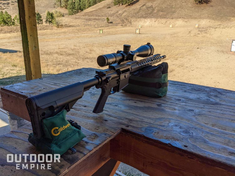 AR-10 setting on range bags looking down range
