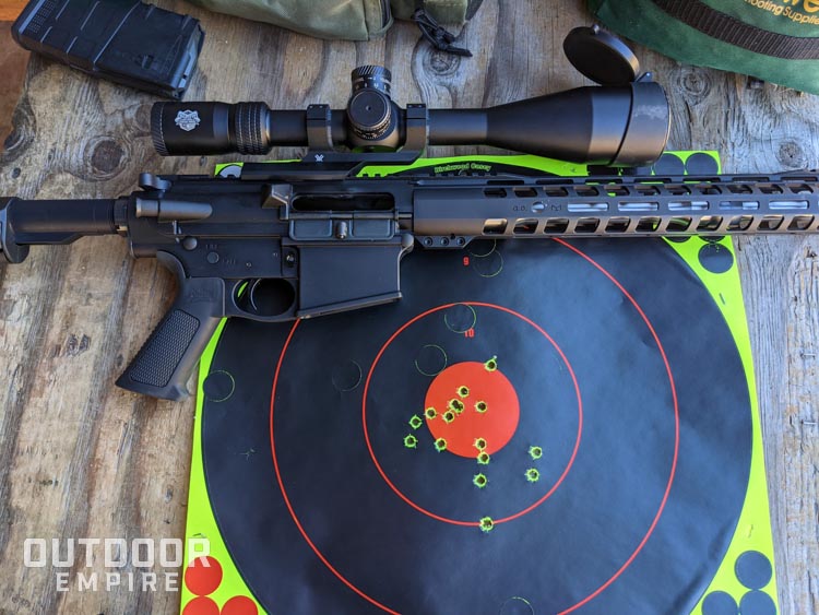 Rifle sitting on target with 16 shots in six inch group