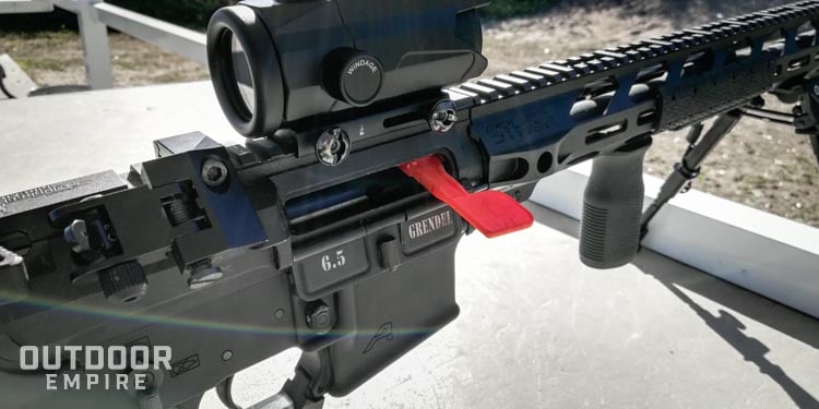 Screws that mount red dot sight to rail of rifle