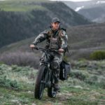 Hunter riding ebike on the mountains