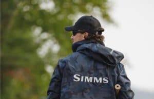 fisher back view wearing M's Simms Challenger Jacket