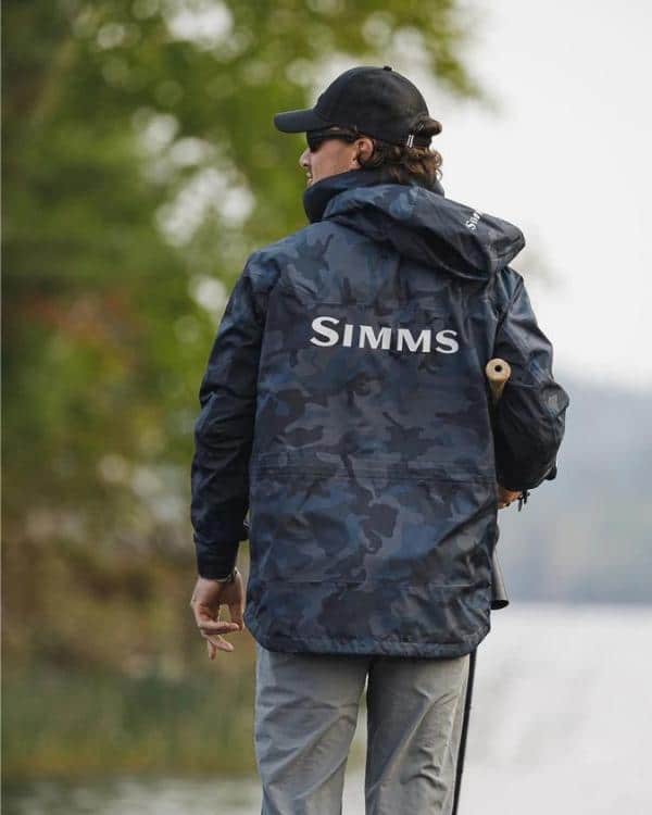 fisher back view wearing M's Simms Challenger Jacket