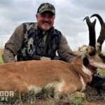 Hunter with pronghorn with black patch on cheek