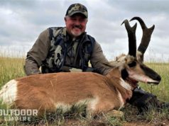 hunter with pronghorn with black patch on cheek
