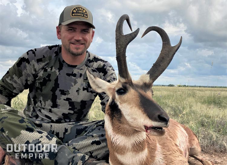 Hunter sitting with trophy class pronghorn buck