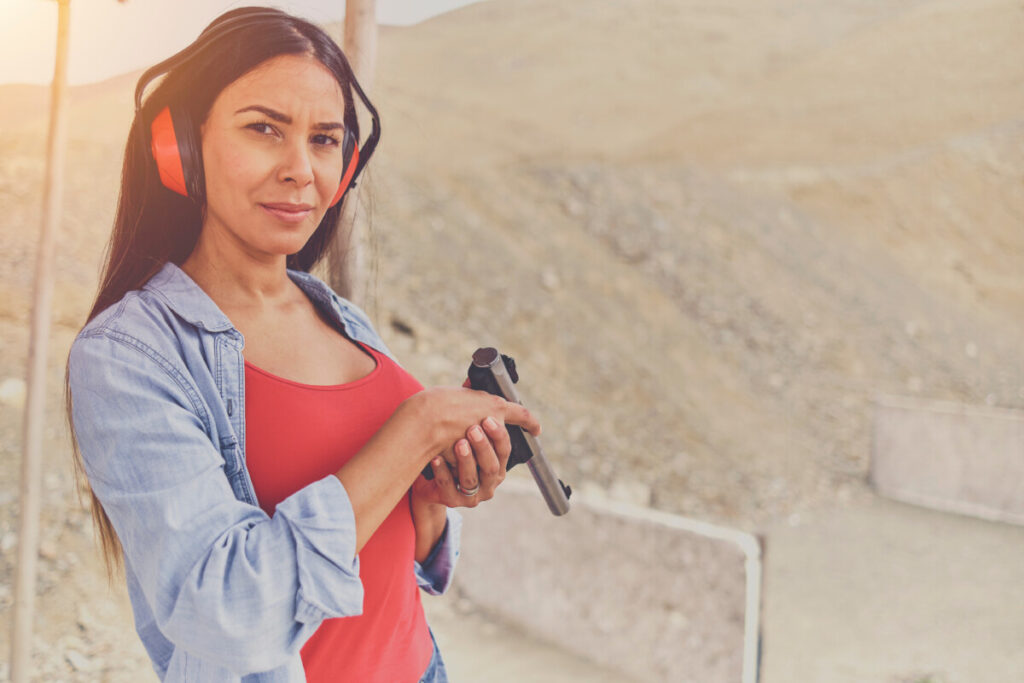 woman wearing earmuff in the shooting range